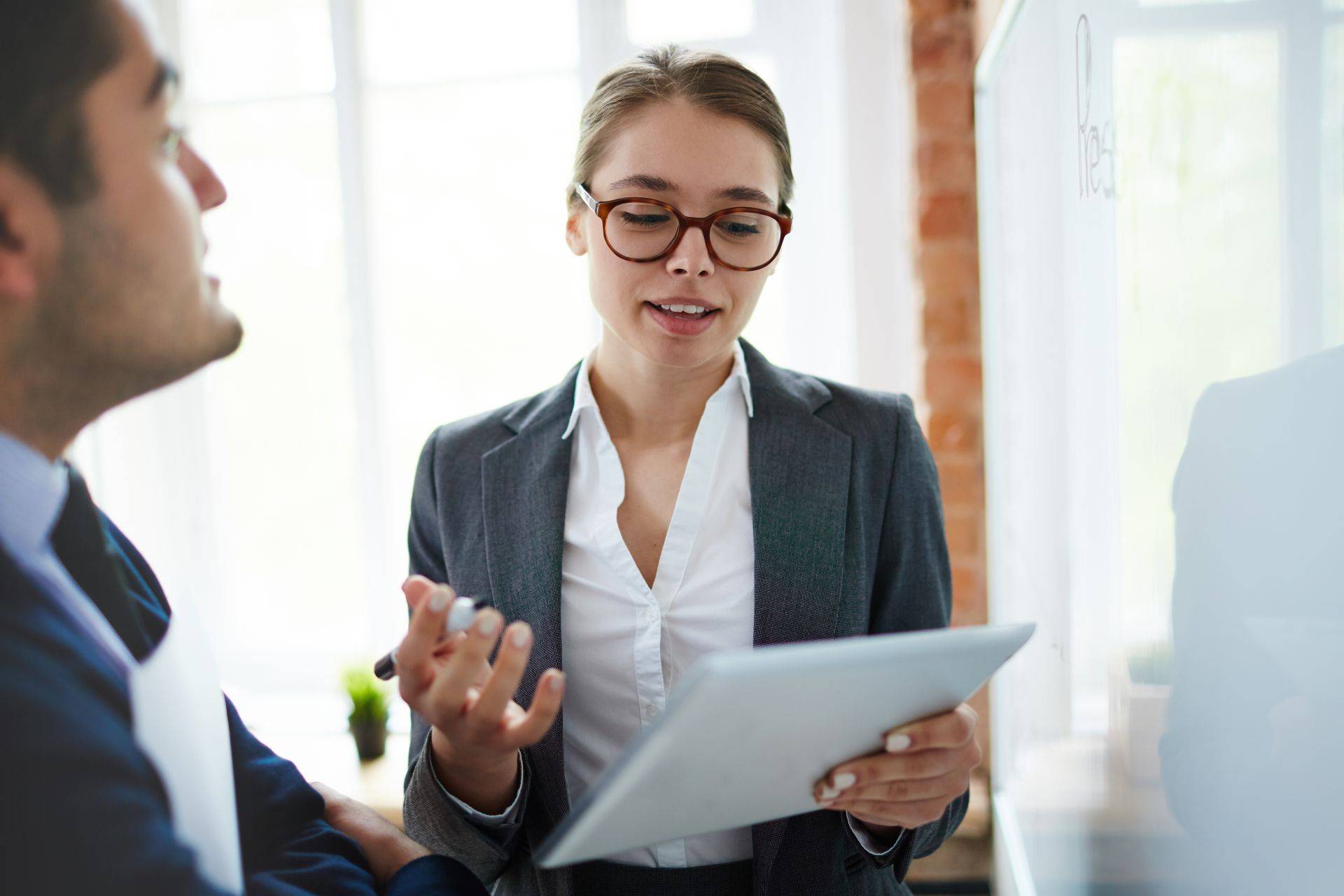 A business professional demonstrating confident body language during a presentation