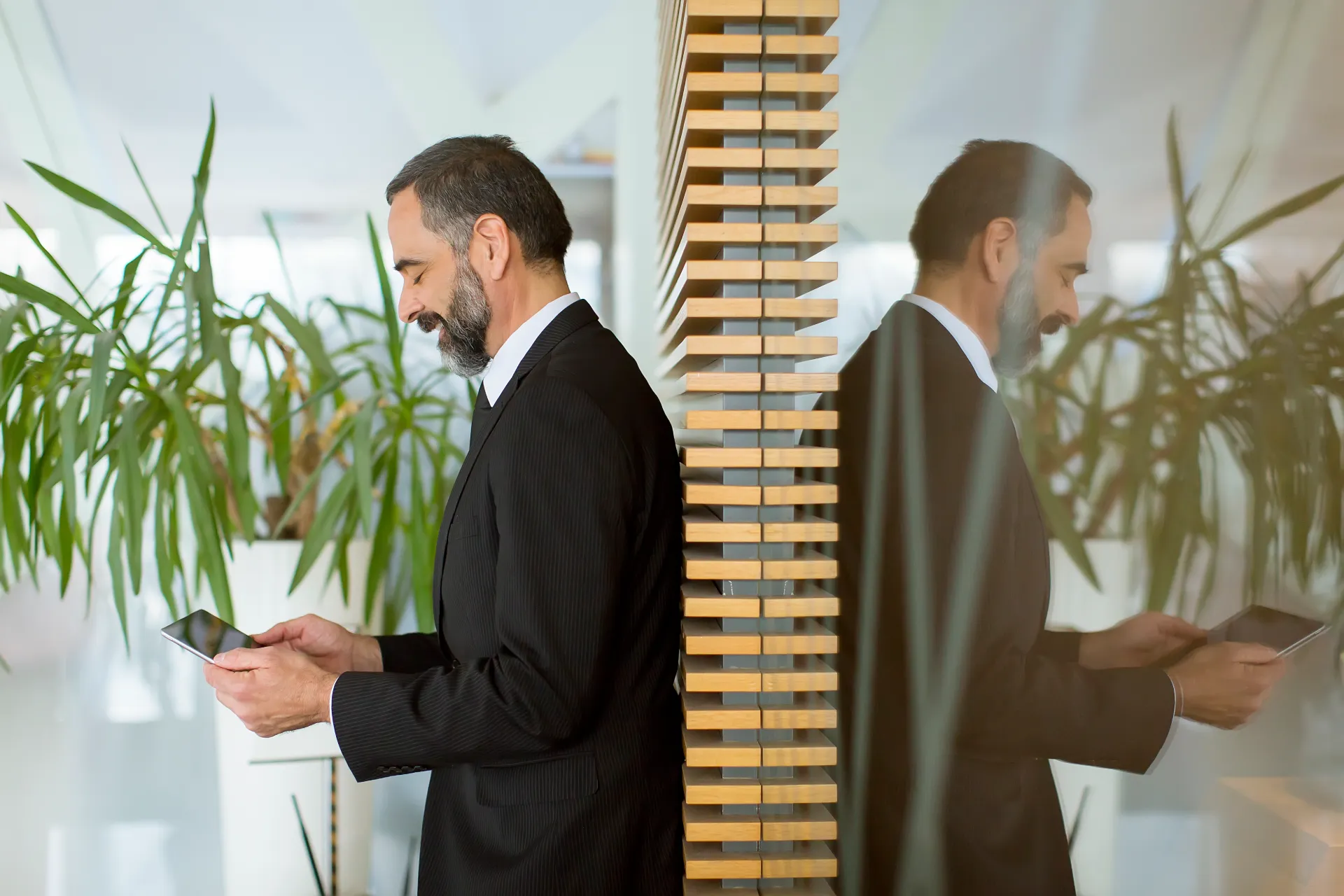 middle-age-businessman-with-tablet-office