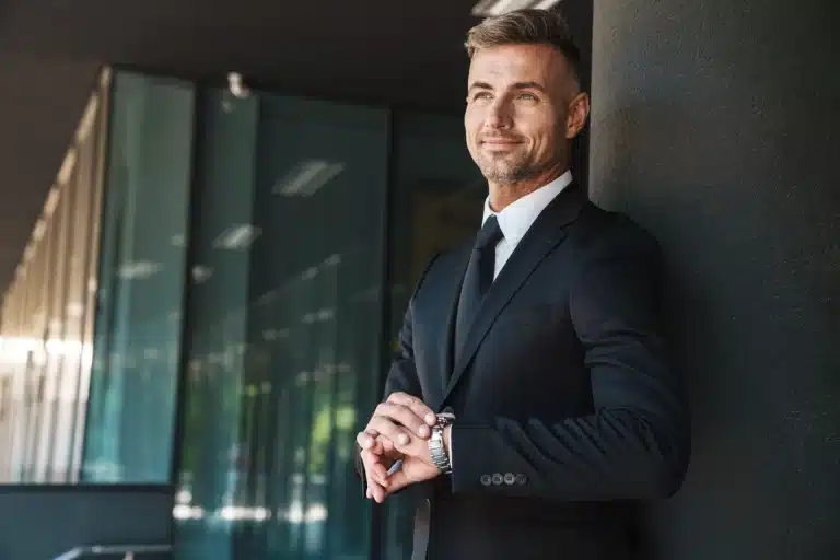 cheerful-happy-mature-handsome-grey-haired-business-man-outdoors-street-near-business-center-touching-watch-clock